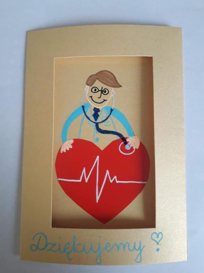 Kartka wykonana przez Panią Agnieszkę Kluczny. Doktor bada przy pomocy stetoskopu chore serce.